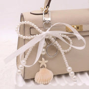 Pearl Bow Bag Charm with Seashell & Starfish Pendant – Coquette Aesthetic Ribbon Purse Keychain (AKY1284)