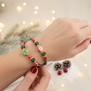 Christmas Beaded Charm Bracelet – Santa face, a deer, a Christmas tree, and a present.