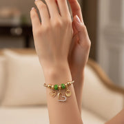 Heart Charm Bangle with Green Crystal Accents