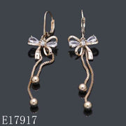 E17917 - 18K Gold Plated Ribbon Bow Dangle Earrings with Cubic Zirconia & Hanging Bead Tassels