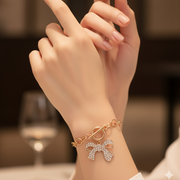 Bold Glam: Crystal Bow Charm Bracelet with Chunky Chain