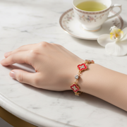 Elegant Red Clover & Crystal Accent Bracelet - Adjustable Gold Tone