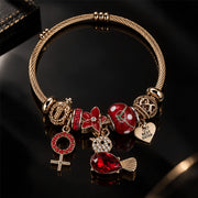 HB00007 - Ruby Radiance Gold-Plated Charm Bracelet with Red Bead, Crystal, Heart & Cross Charms – 100% Brass