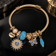 HB00013 - Champagne Gold-Plated Blue Crystal & Turquoise Charm Bangle Bracelet – 100% Brass