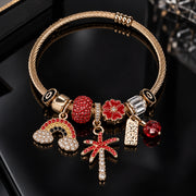 HB00019 - Gold-Plated Red Crystal Charm Bracelet with Rainbow, Flower & Starburst Charms – 100% Brass