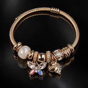 HB00026 - Gold Plated Charm Bangle Bracelet with Butterfly, Love & Crystal Charms – 100% Brass