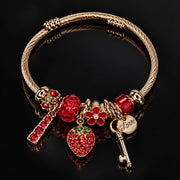 HB00028 - Gold-Plated Strawberry Charm Bracelet with Red Rhinestone Accents – 100% Brass