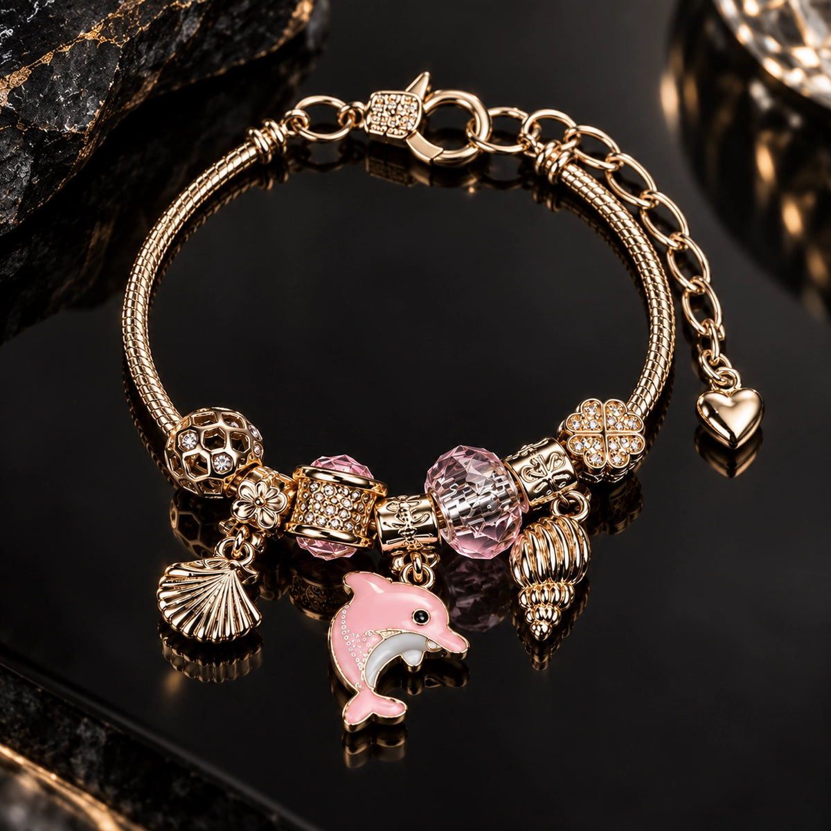 HB00078 - Gold Tone Ocean Charm Bracelet with Pink Dolphin, Seashells & Crystal Four-Leaf Clover